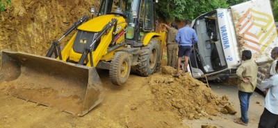 Andhra Police uses JCB to scrape hillside to deblock roadway