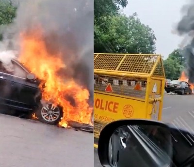 Delhi: Car rams into divider, catches fire