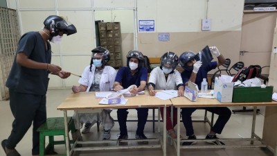 Junior doctors at Hyderabad's Osmania Hospital wear helmets